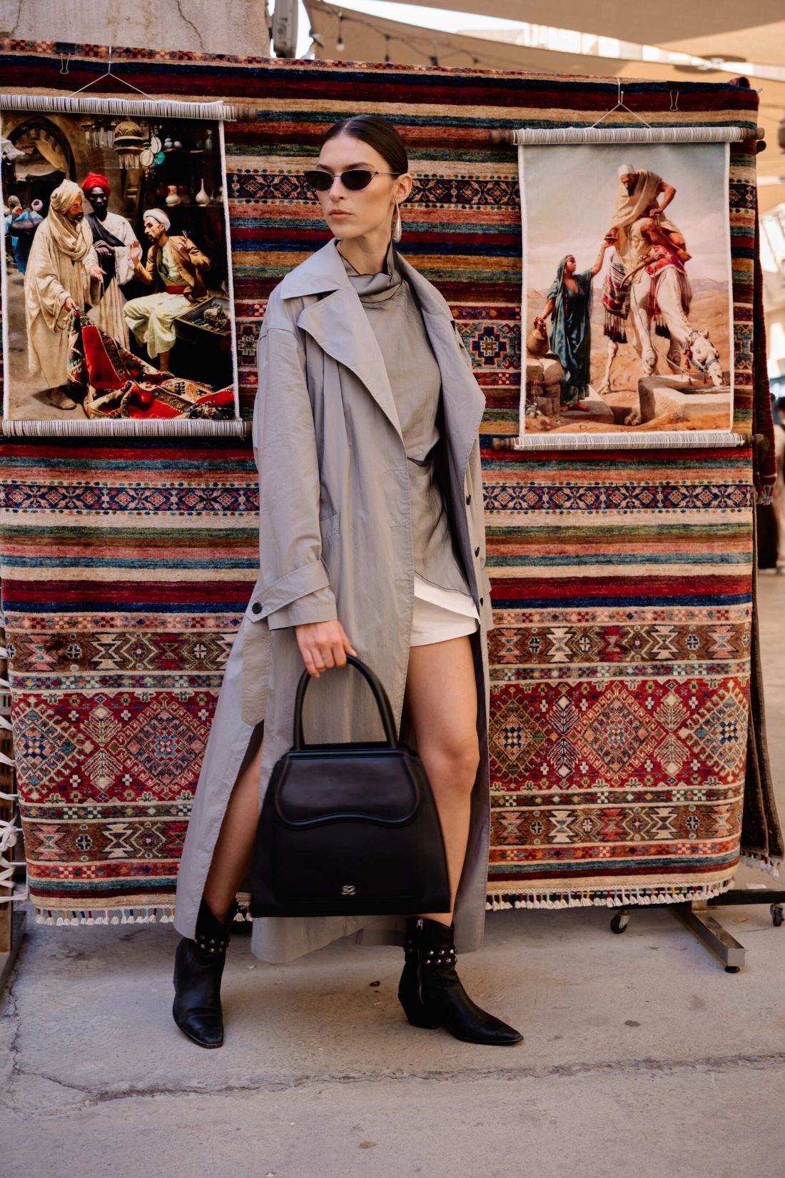 The Dr. Bag in black by Sally Sarieddine, carried by hand