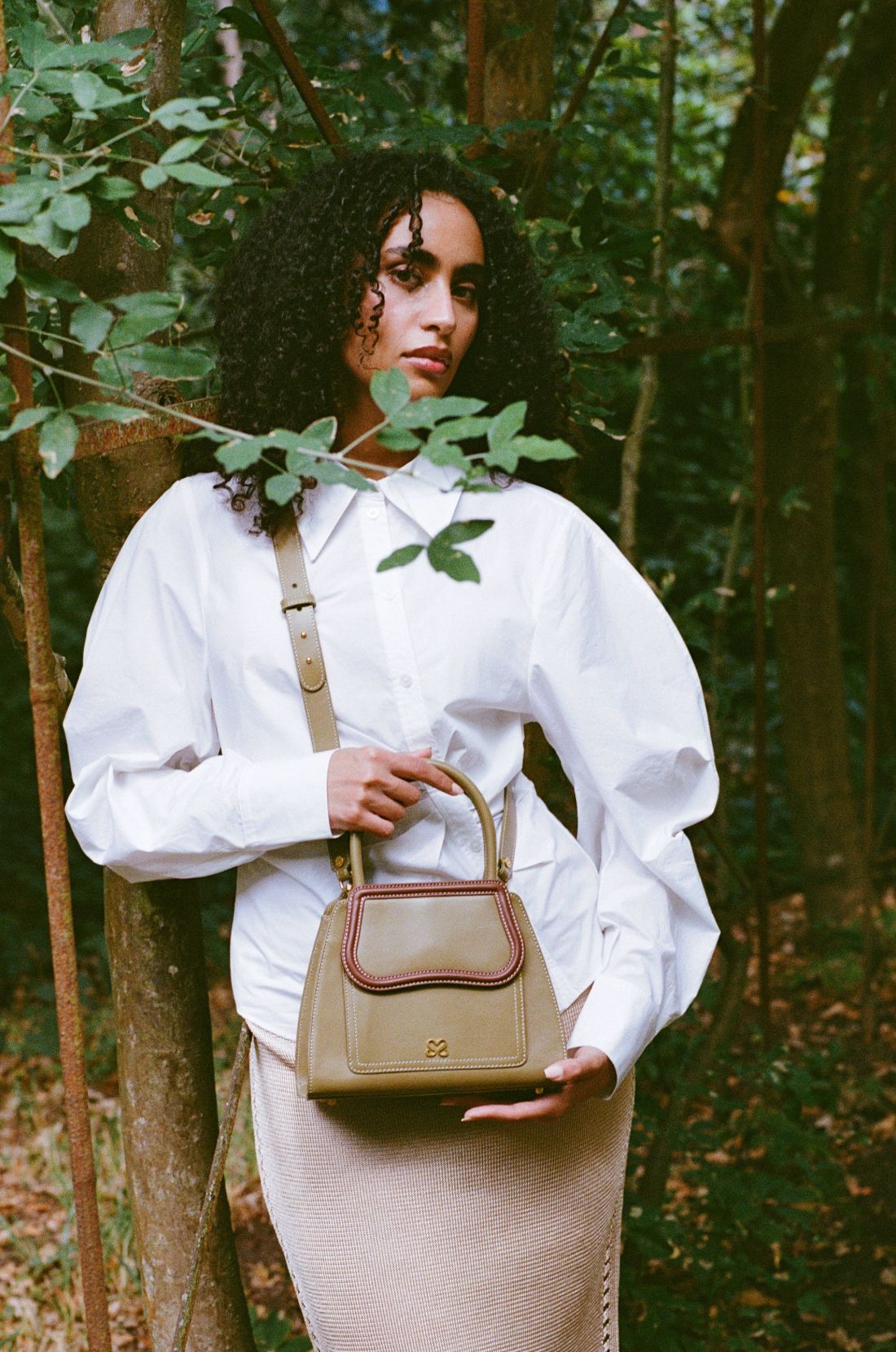 The Mini Dr. Bag by Sally Sarieddine, carried by hand