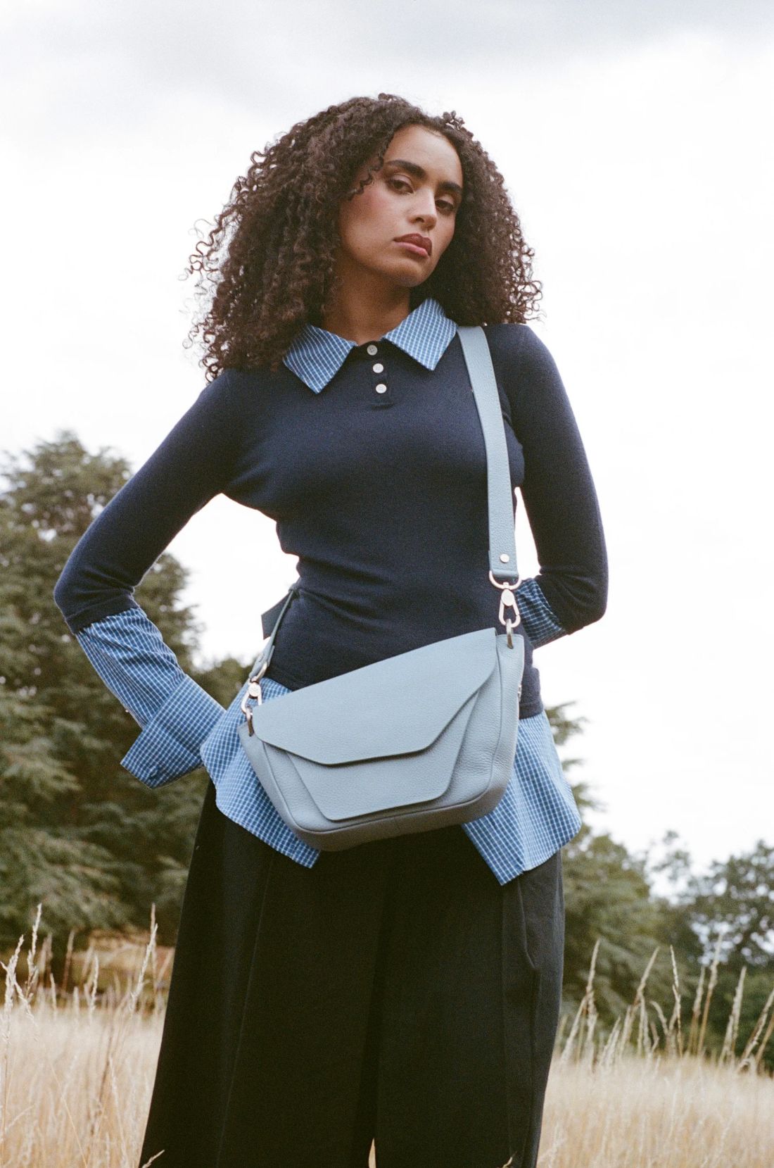 The Terra Bag in sky by Sally Sarieddine, worn crossbody